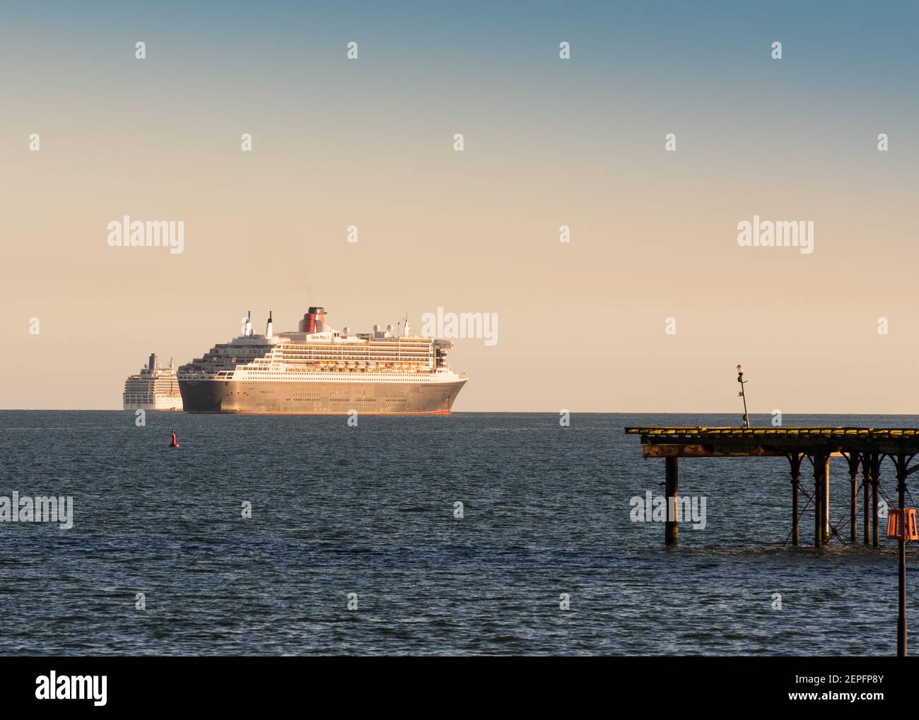 Queen Mary 2 Liner of the Cunard Line at anchor off the coast of Devon during the CV19 pandemic. Stock Photo