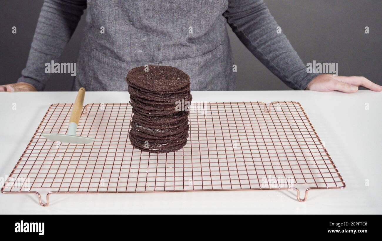 Step by step. Cooling freshly baked chocolate cookies on a wire rack ...