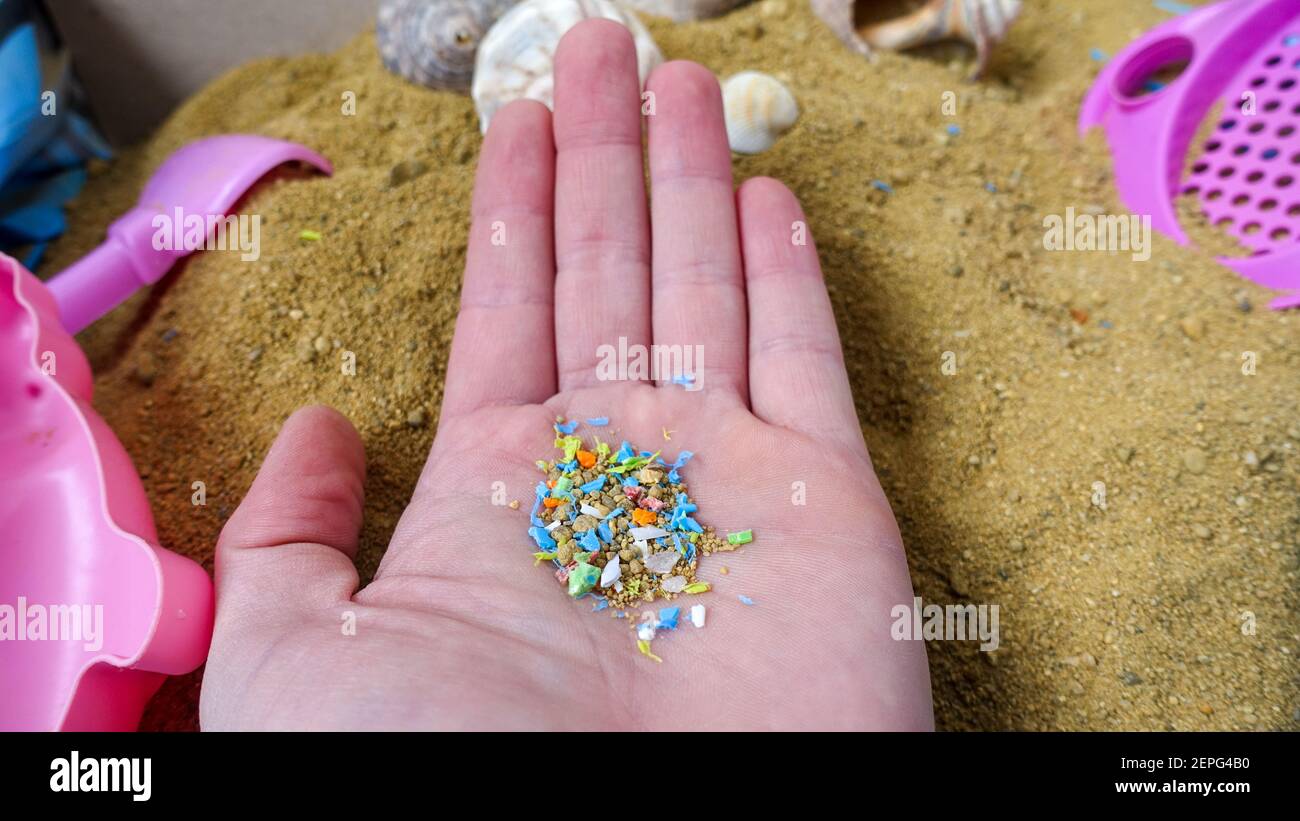 Side View Of a Person Holding Micro Plastics In His Hand. Non-Recyclable Materials. Selective Focus With Shallow Depth Of Field. Holding Microplastics Stock Photo