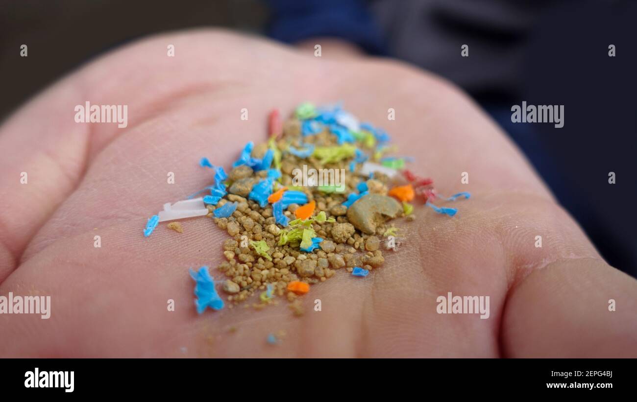 Side View Of a Person Holding Micro Plastics In His Hand. Non-Recyclable Materials. Selective Focus With Shallow Depth Of Field. Holding Microplastics Stock Photo