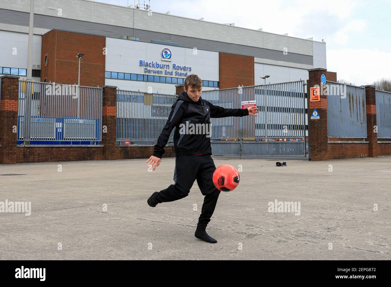 Blackburn, UK. 27th Feb, 2021. Lads playing football in front of Ewood Park in Blackburn, UK on 2/27/2021. (Photo by Conor Molloy/News Images/Sipa USA) Credit: Sipa USA/Alamy Live News Stock Photo