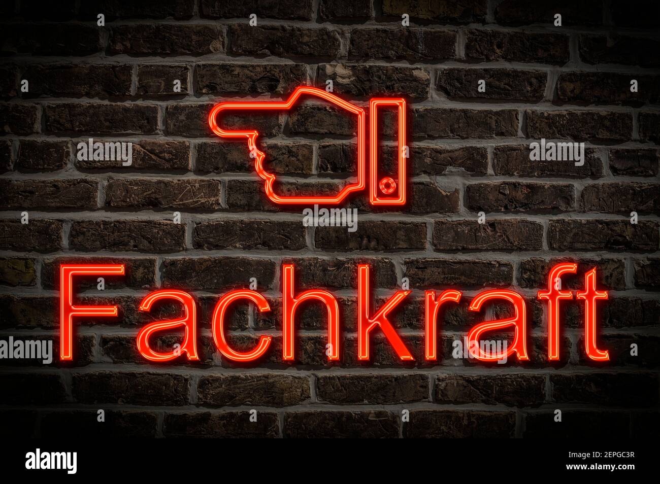 Detail photo of a a neon sign on a wall with the inscription Fachkraft (Specialist) Stock Photo