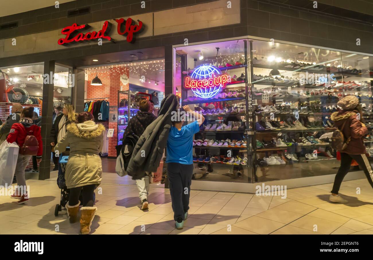 Crowds of last minute shoppers at the Laced Up sneaker store in the Queens  Center Mall in the borough of Queens in New York on so-called Super  Saturday. the Saturday prior to