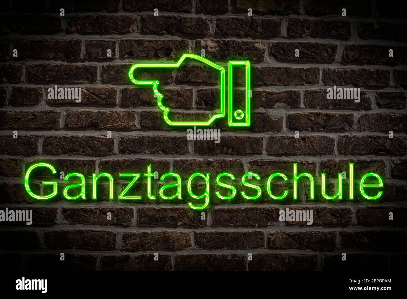 Detail photo of a a neon sign on a wall with the inscription Ganztagsschule (full-time school) Stock Photo