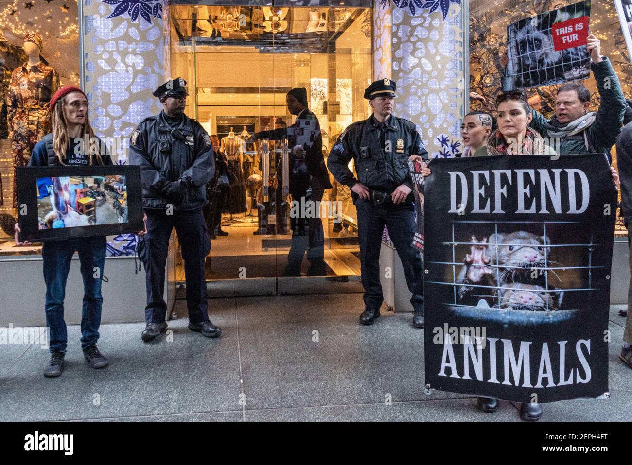 Animal rights activists protest the sale of fur outside French fashion ...