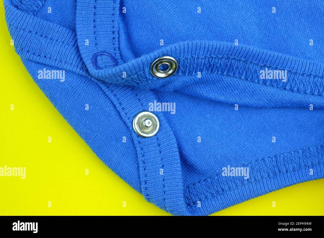 Close up of cotton fabric with rivets. Accessories for children s clothing. Buttons for baby bodysuit. Clothing for babies Stock Photo Alamy