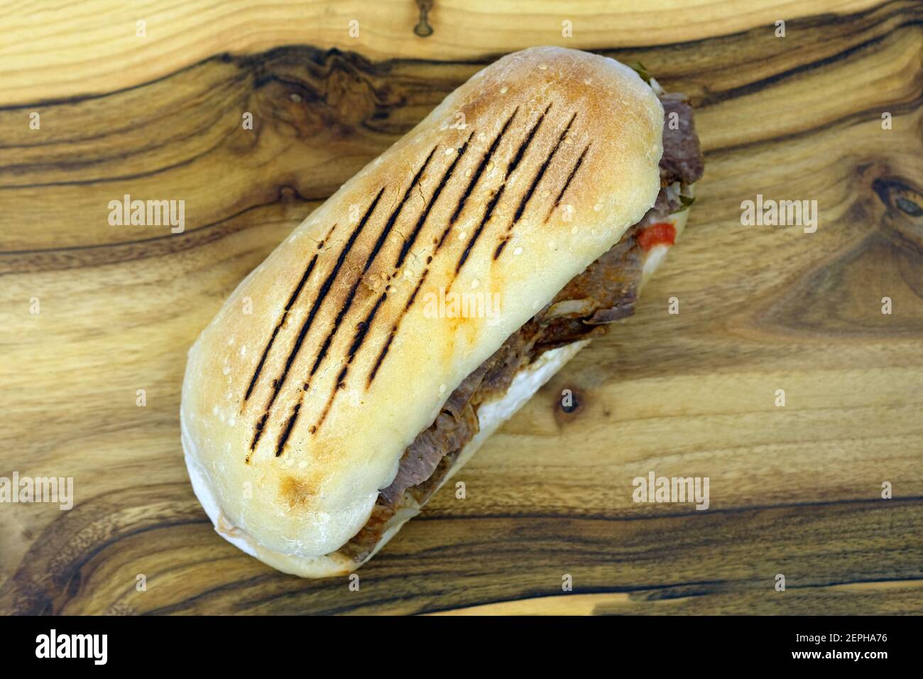 Grilled sandwich with meat top view. Hamburger with veal and vegetables