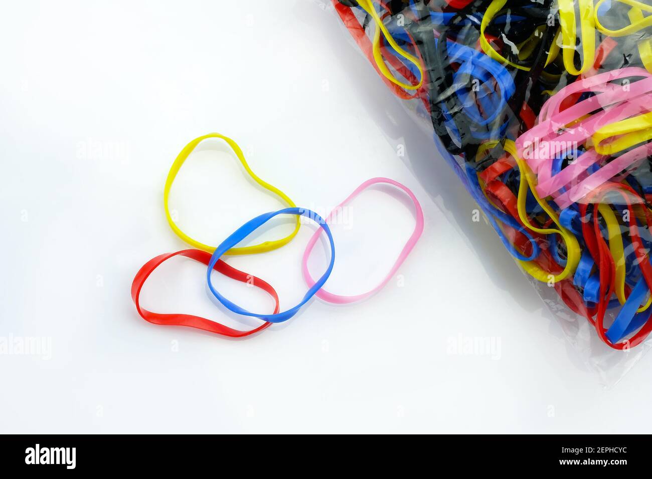 rubber bands for hair tie on white background Stock Photo - Alamy