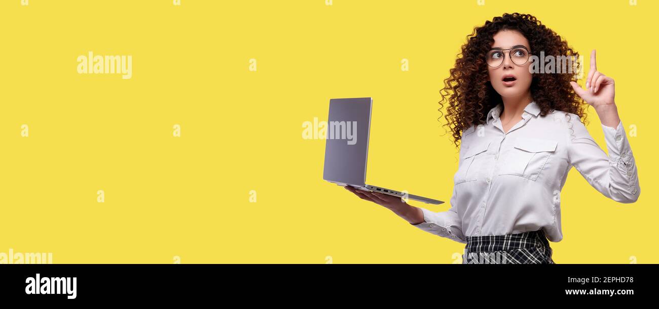Excited businesswoman on white shirt holding laptop computer and ...