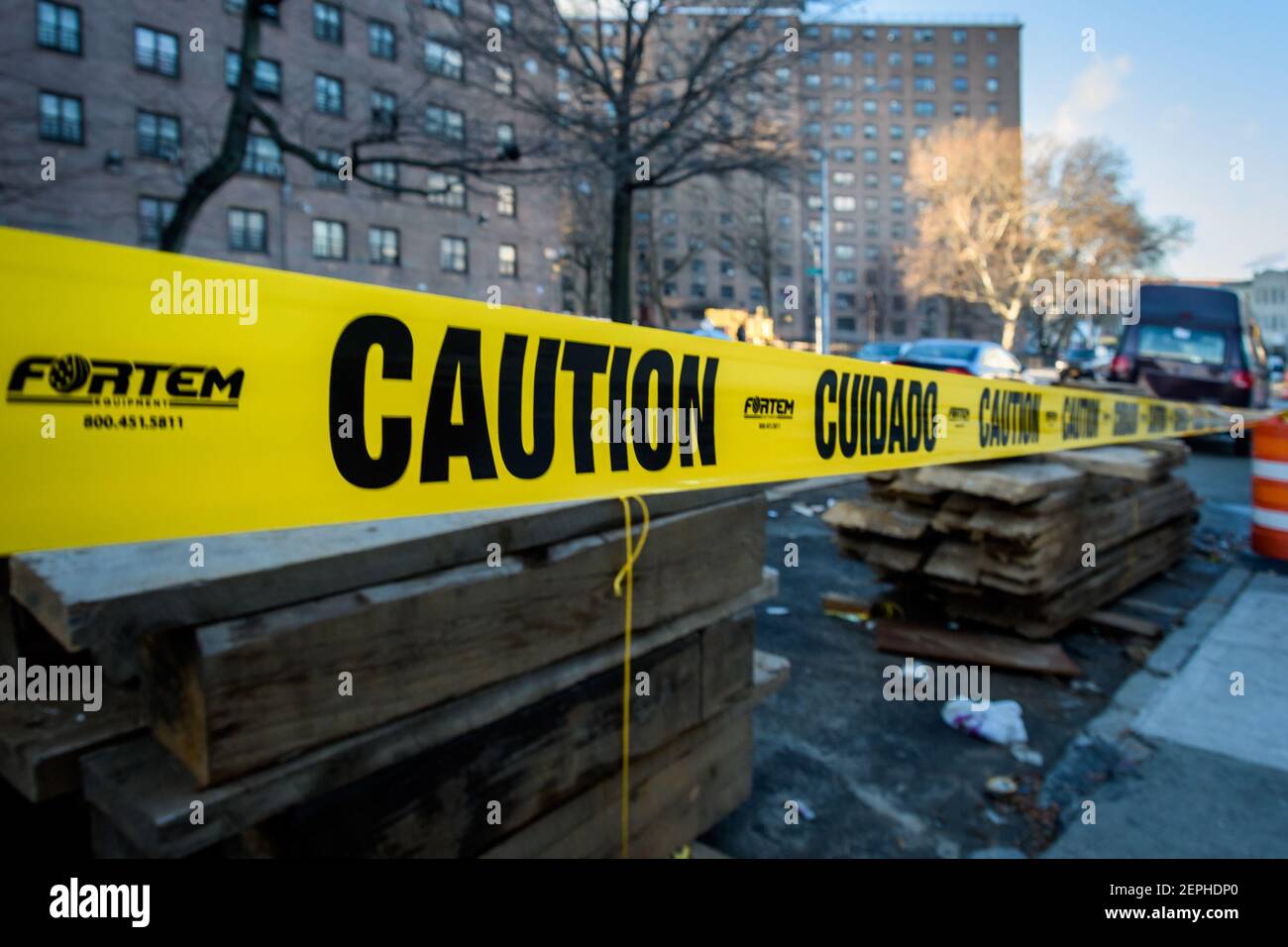 Caution tape around the pipelines laying in the streets of Bushwick