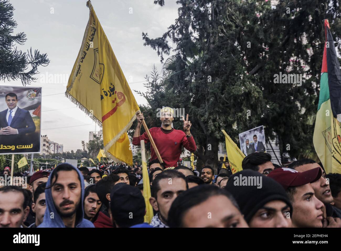 A Palestinian holds a Fatah movement flag during the celebrations