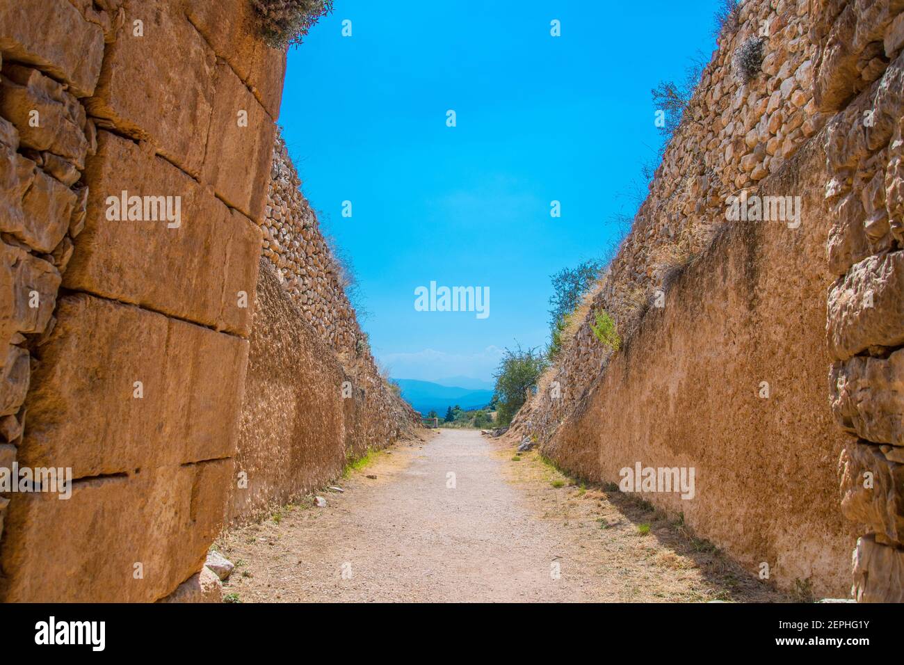 Coming out from the 'Treasury of Atreus' or 'Tomb of Agamemnon' of the citadel of Mycenae. Archaeological site of Mycenae in Peloponnese, Greece Stock Photo