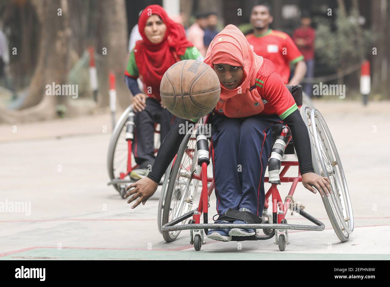 Bangladeshi wheelchair basketball players including men and women play  during a friendly match jointly organized by the Centre for Rehabilitation  of the Paralyzed (CRP) and the International Committee of the Red Cross