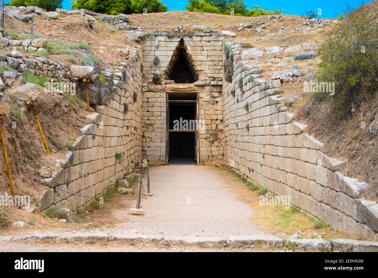 Stomion or entrance to the 'Treasury of Atreus' or 'Tomb of Agamemnon' of the citadel of of Mycenae. Archaeological site of Mycenae in Greece Stock Photo
