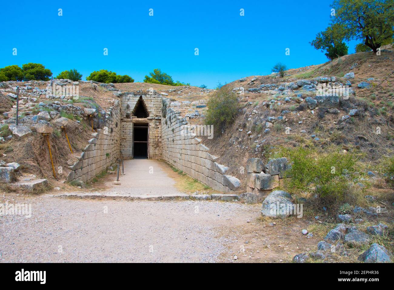 Stomion or entrance to the 'Treasury of Atreus' or 'Tomb of Agamemnon' of the citadel of of Mycenae. Archaeological site of Mycenae in Greece Stock Photo