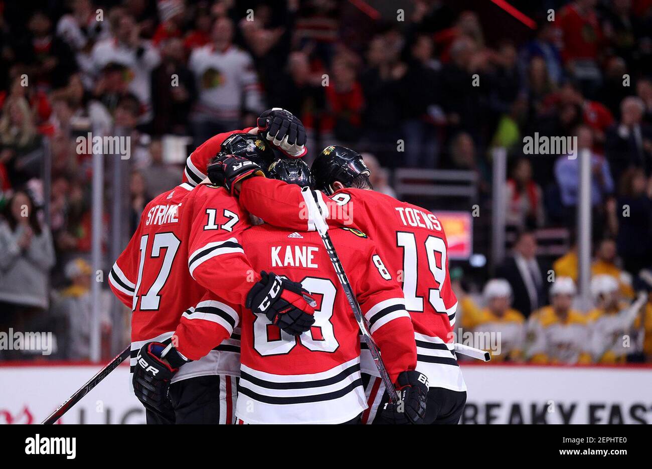 The Chicago Blackhawks' Patrick Kane (88) and Jonathan Toews (19) join their teammates in congratulating Alex DeBrincat after his goal in the first period against the Nashville Predators at the United Center in Chicago on Wednesday, Jan. 9, 2019. The Predators won, 4-3, in overtime. (Chris Sweda/Chicago Tribune/TNS) Stock Photo