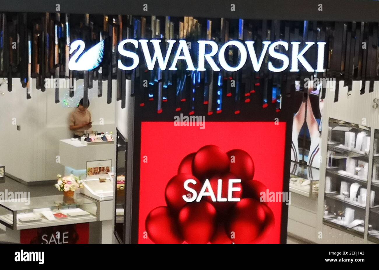 FILE--The sign of sale is seen at a Swarovski store in Chongqing, China, 12  June 2019. As Austrian producer of glass Swarovski celebrates its 125th  anniversary, there¡¯s little cause for jubilation. Revenue