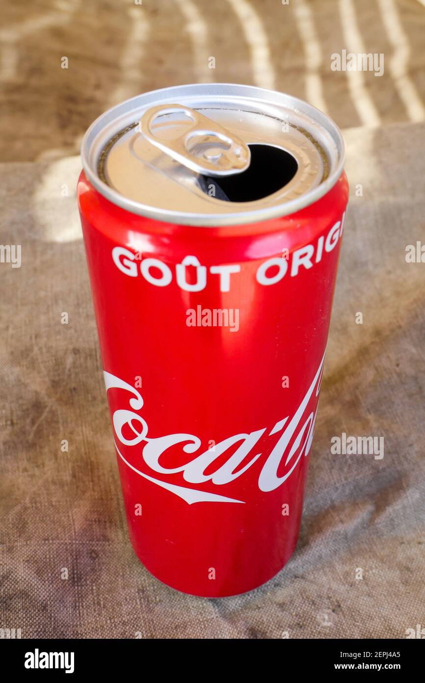 Can of Coca-Cola putted on a vintage canvas tarpaulin, France Stock Photo