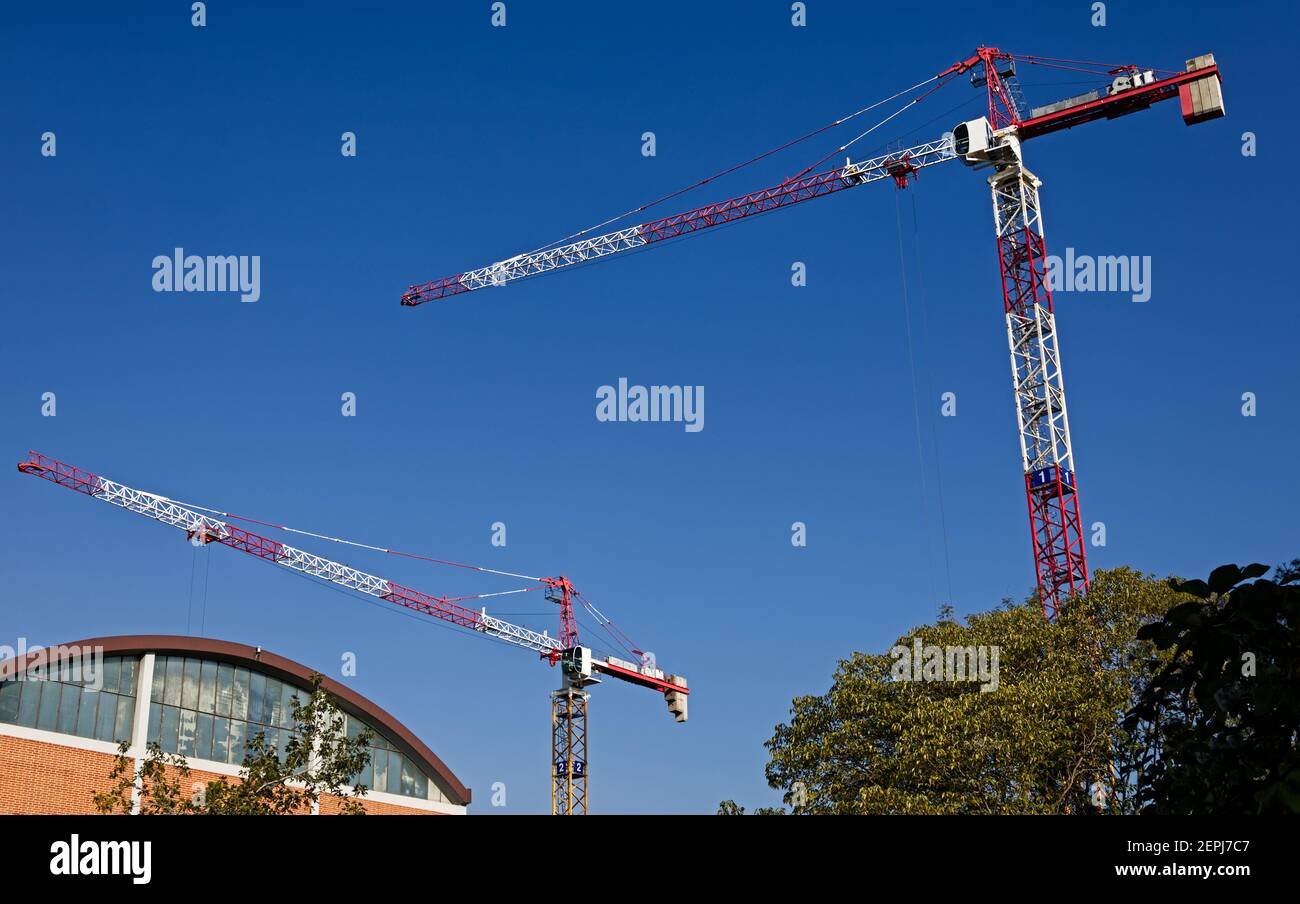 High tower cranes work on building site. Bologna, Italy, construction