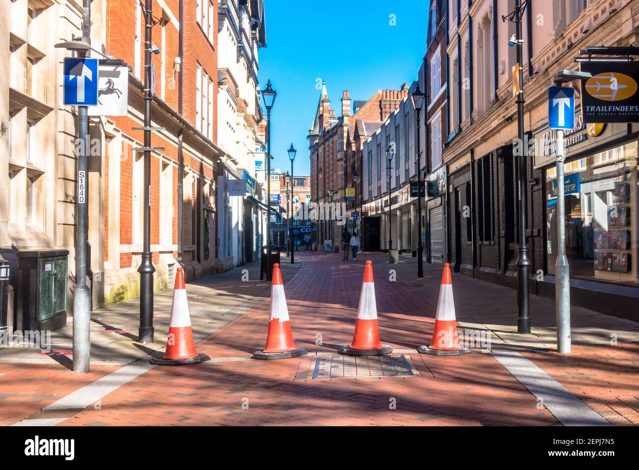 Access to Cross Street in Reading town centre s blocked off with a line of orange traffic cones. Stock Photo