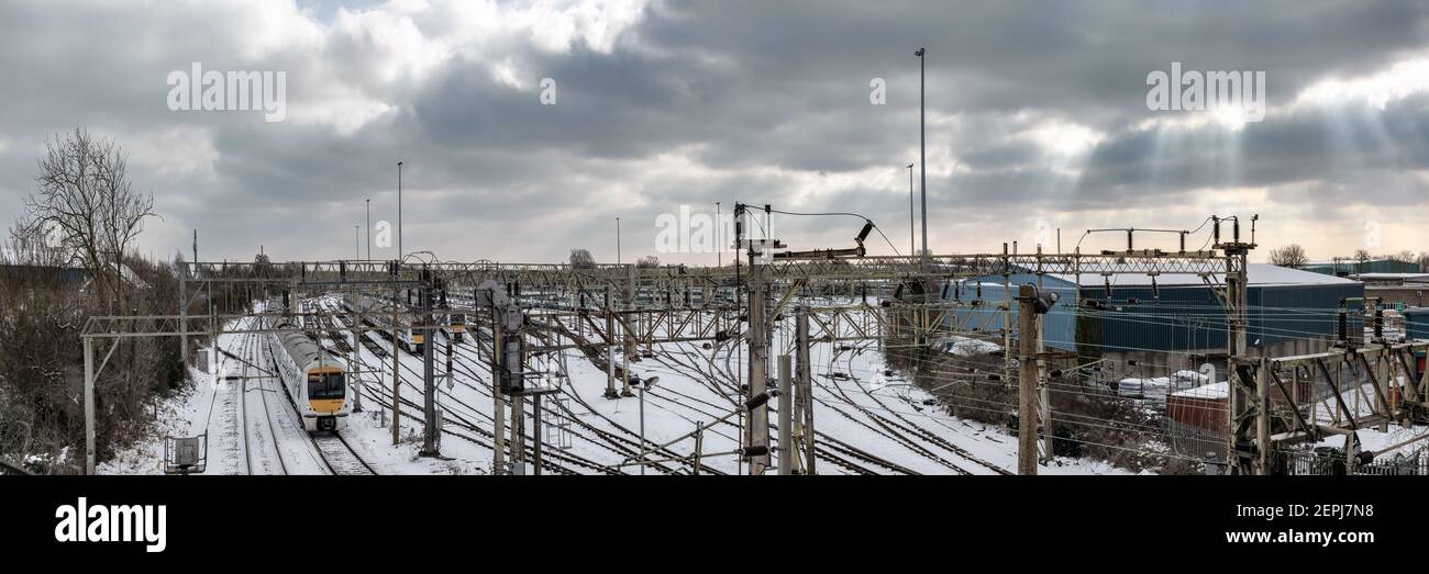 SOUTHEND-ON-SEA, ESSEX, UK - FEBRUARY 10, 2021:  Panorama view of the shoebury sidings on the C2C line in winter with snow on the ground Stock Photo