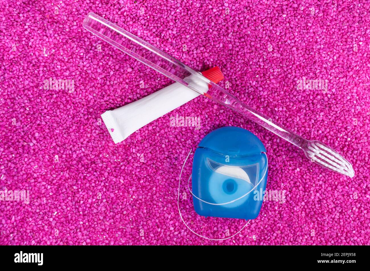 Still life with a toothbrush dental floss and toothpaste. the ...