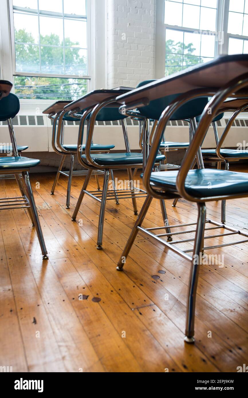 School desks in a classroom interior Stock Photo