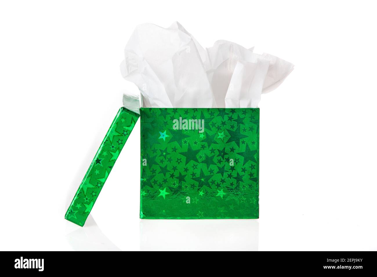 A green foil gift box with tissue paper inside. Stock Photo