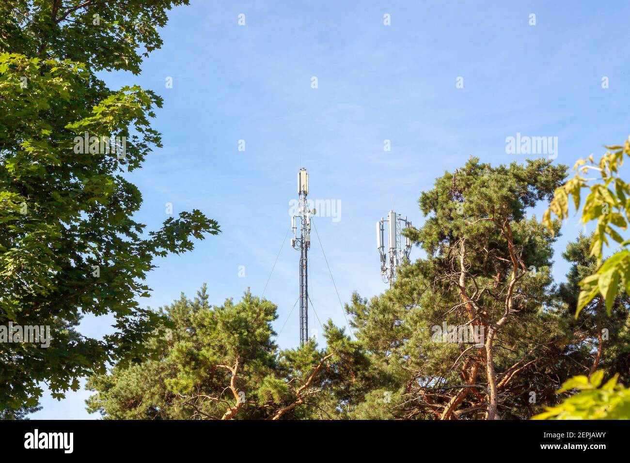 telecommunication antenna at blue sky background and copyspace. network broadcast tower Stock Photo