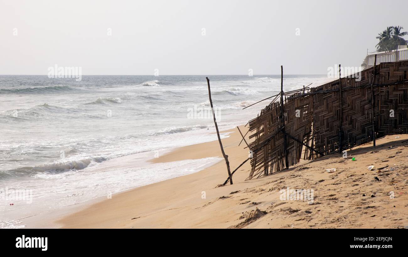 Monrovia Liberia Atlantic ocean beach trash pollution. Extreme poverty and hunger. Pollution and filth on ocean beaches. Tropical climate, environment.  Civil war and economic failures. Stock Photo