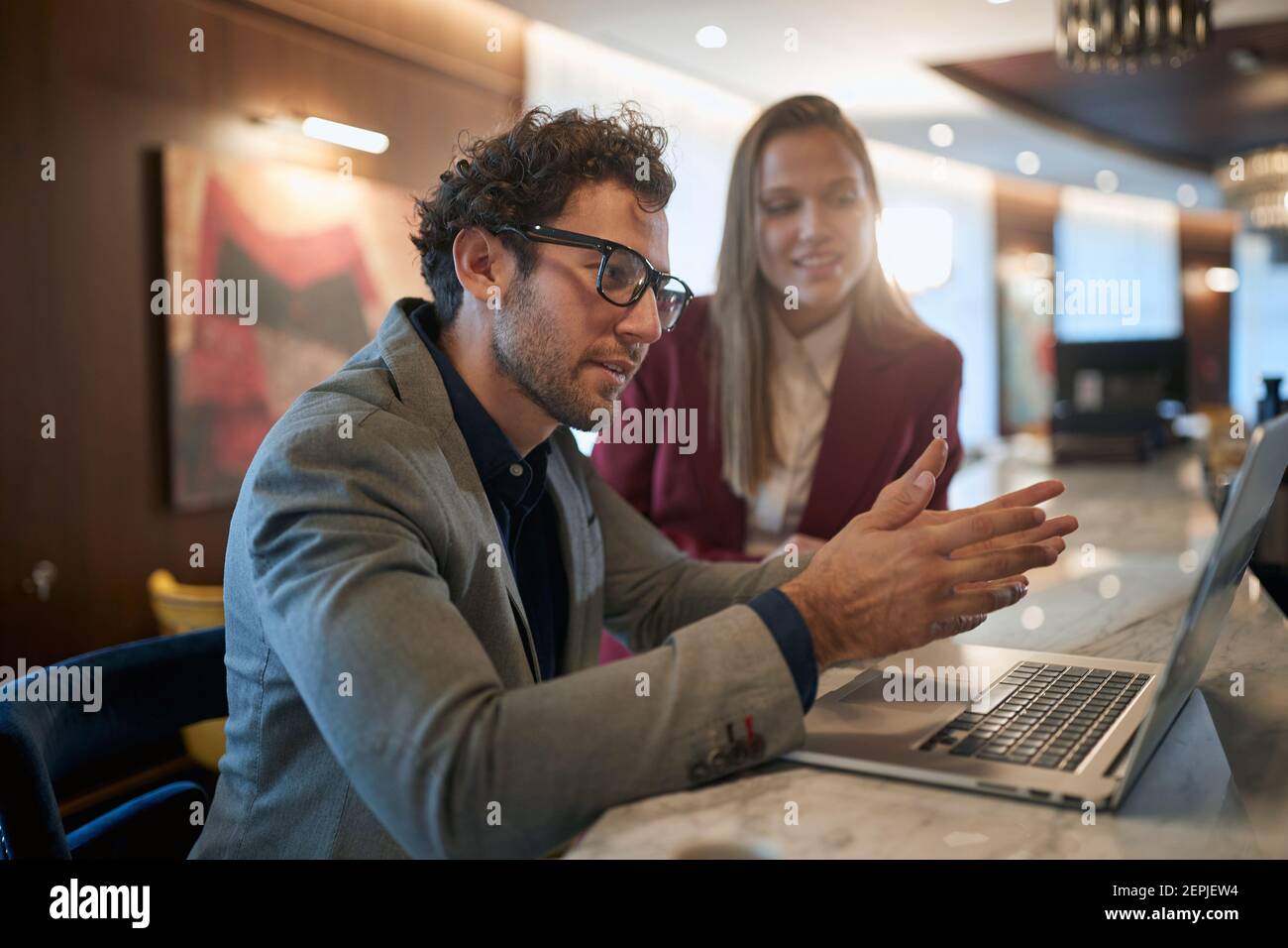 Two young colleagues chatting together on a break Stock Photo