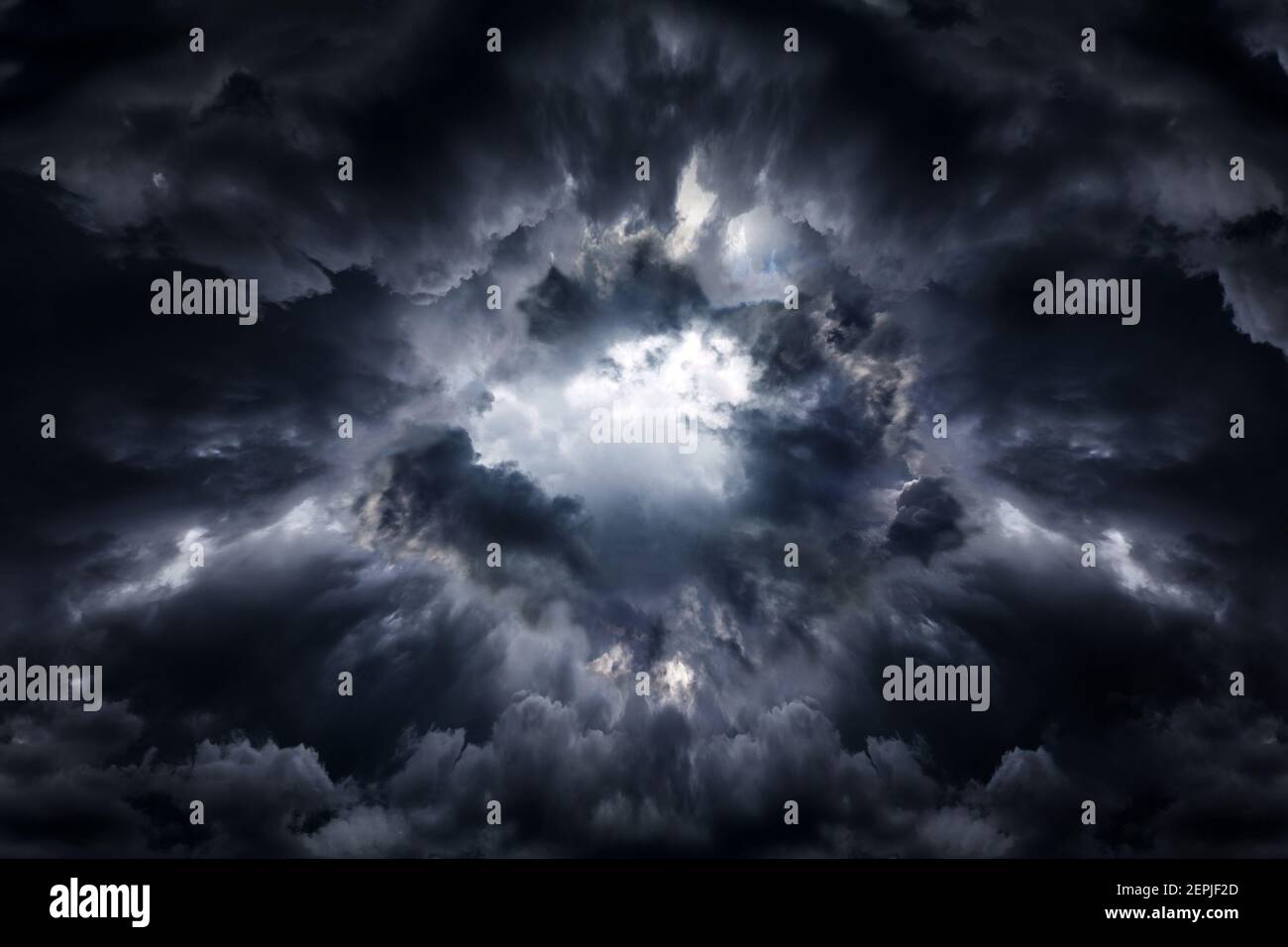 Hole in the Dark and Dramatic Storm Clouds Stock Photo