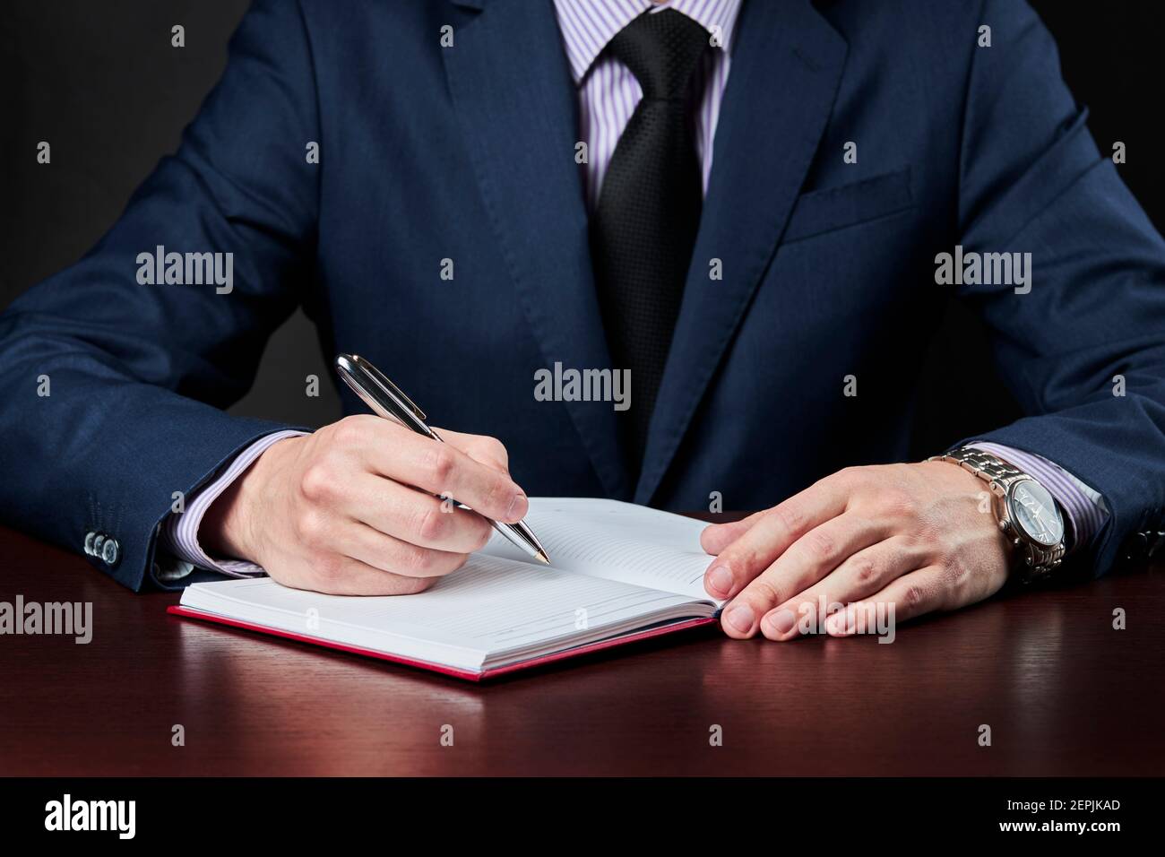 business plan and schedule concept. caucasian businessman write something at his diary book Stock Photo