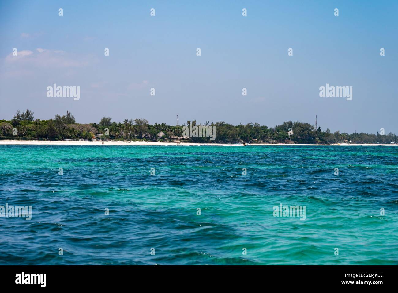 View of Diani coast with hotel amongst palm trees by beach and Indian ocean, Diani, Kenya Stock Photo