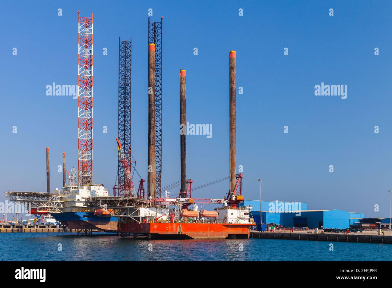 Offshore Supply Ship and crude oil platform are moored near the coast of Red Sea in Saudi Arabia port Stock Photo