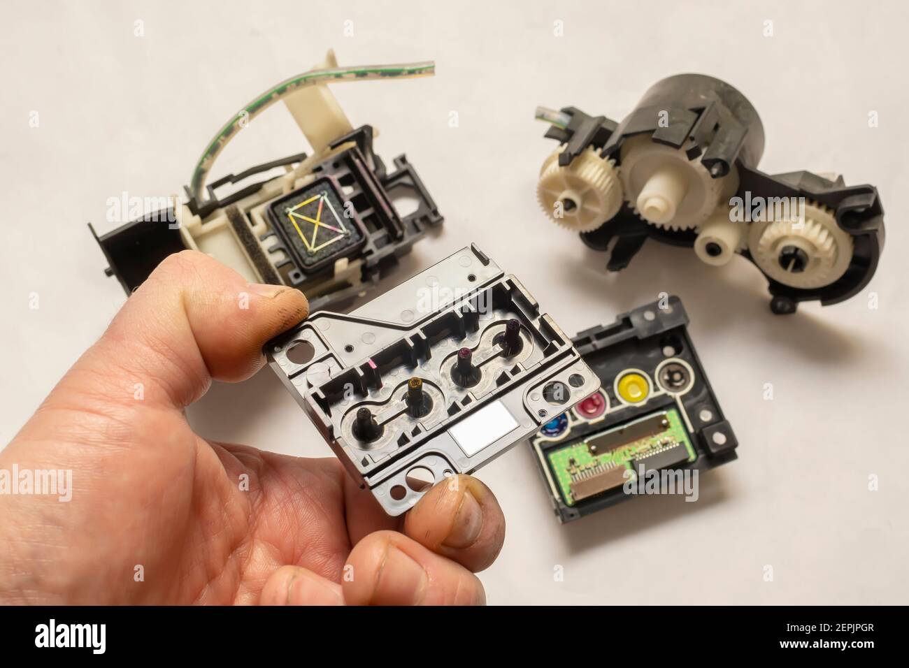 disassembled color inkjet printer printhead mechanism with pump and