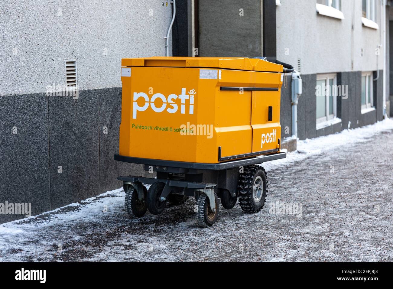 Modern electric mail trolley or mail carrier cart of Posti Group Ltd during winter in Helsinki, Finland Stock Photo
