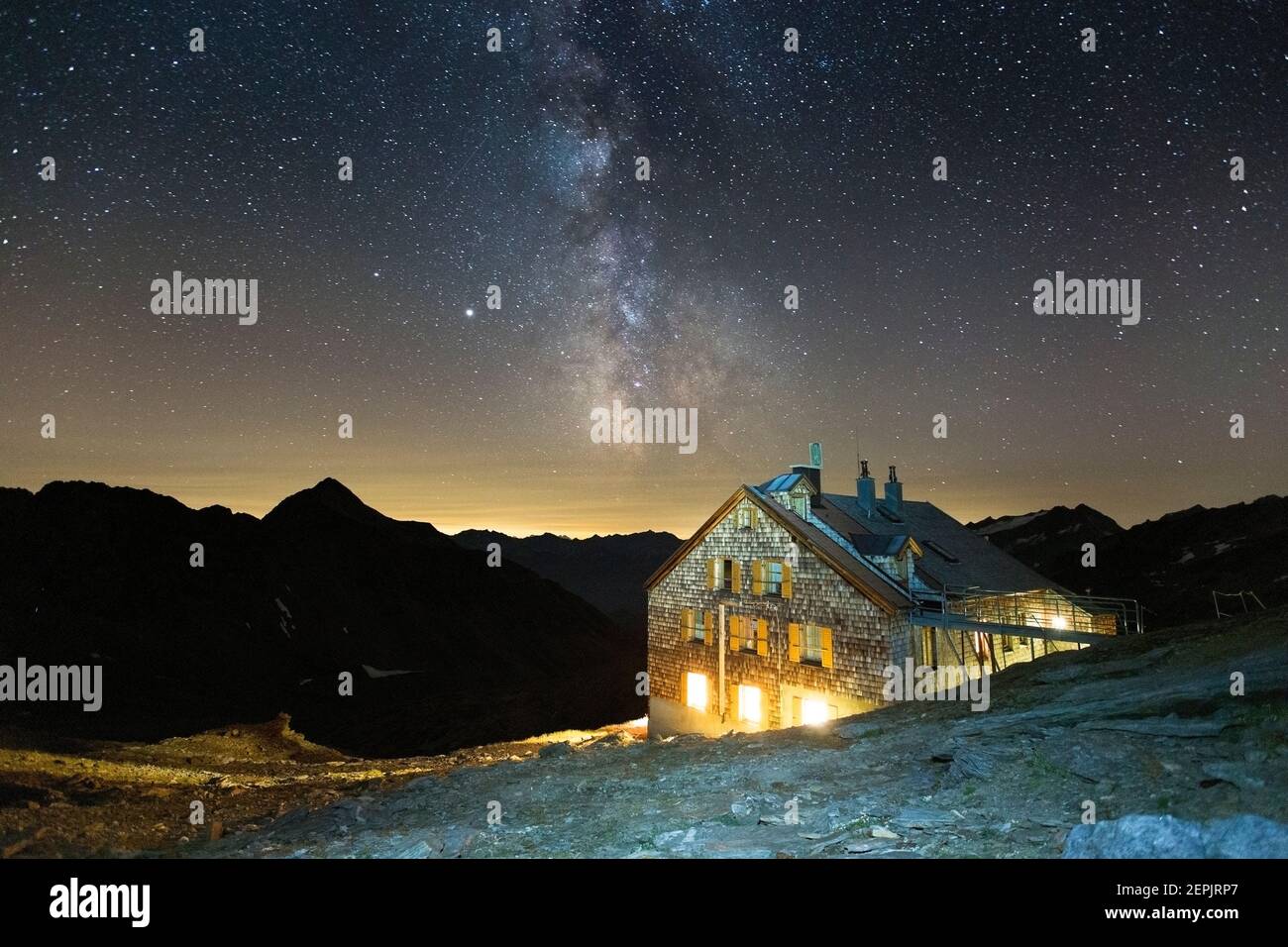 Defreggerhaus alpine refuge. Night landscape, milky way. Venediger mountain group. Austrian Alps. Europe. Stock Photo