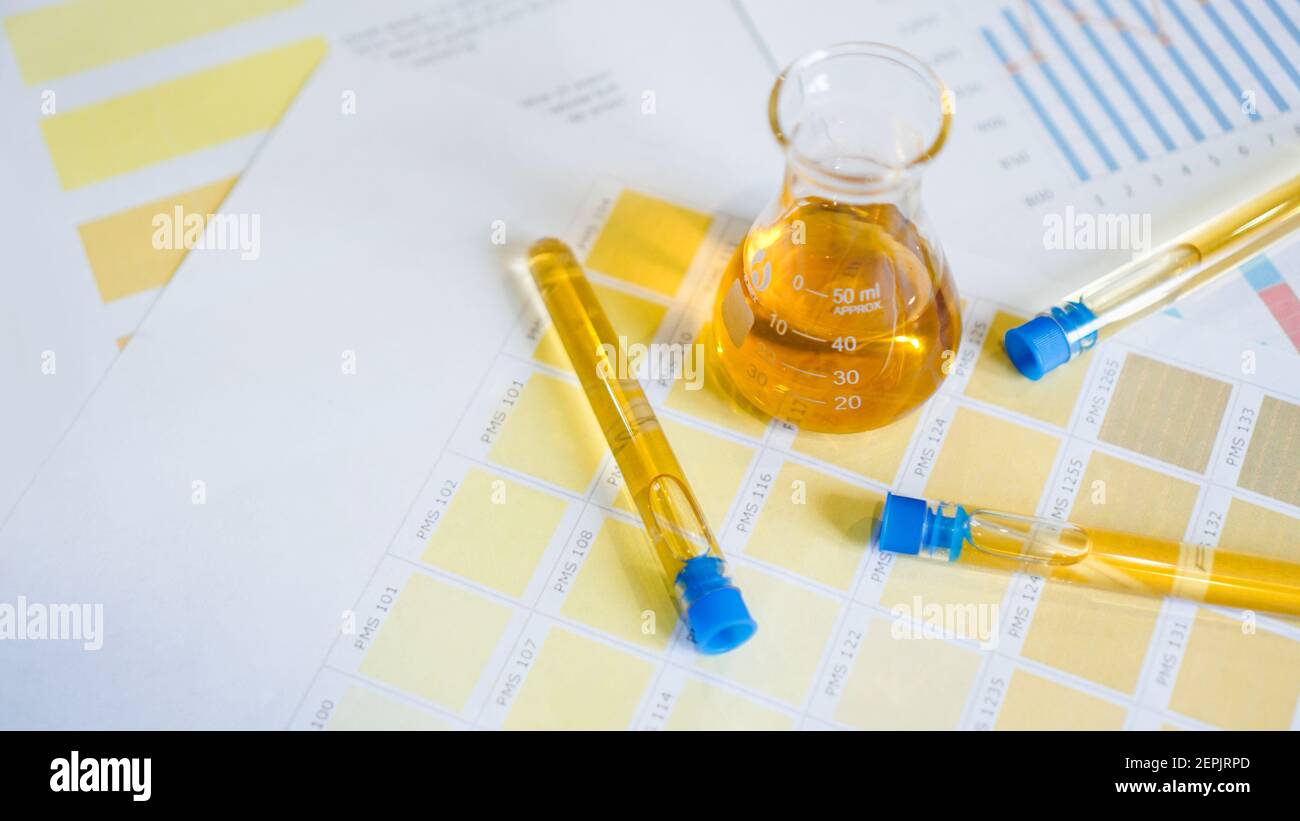 Flask and test tubes with urine on medical color schemes. The concept