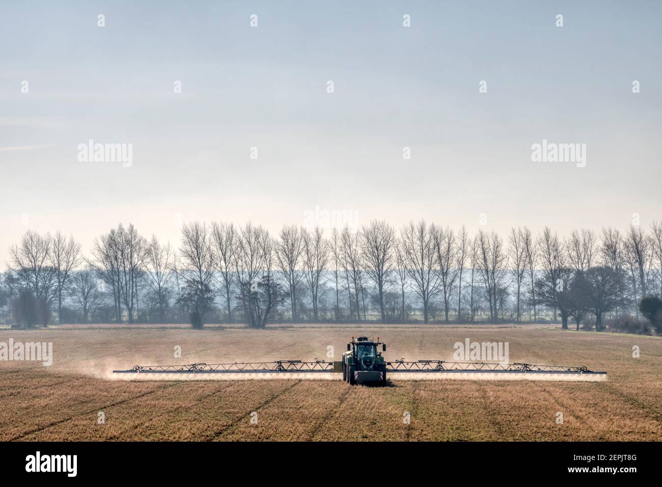 Agricultural spraying on a Norfolk arable farm, on a bright February morning. Stock Photo