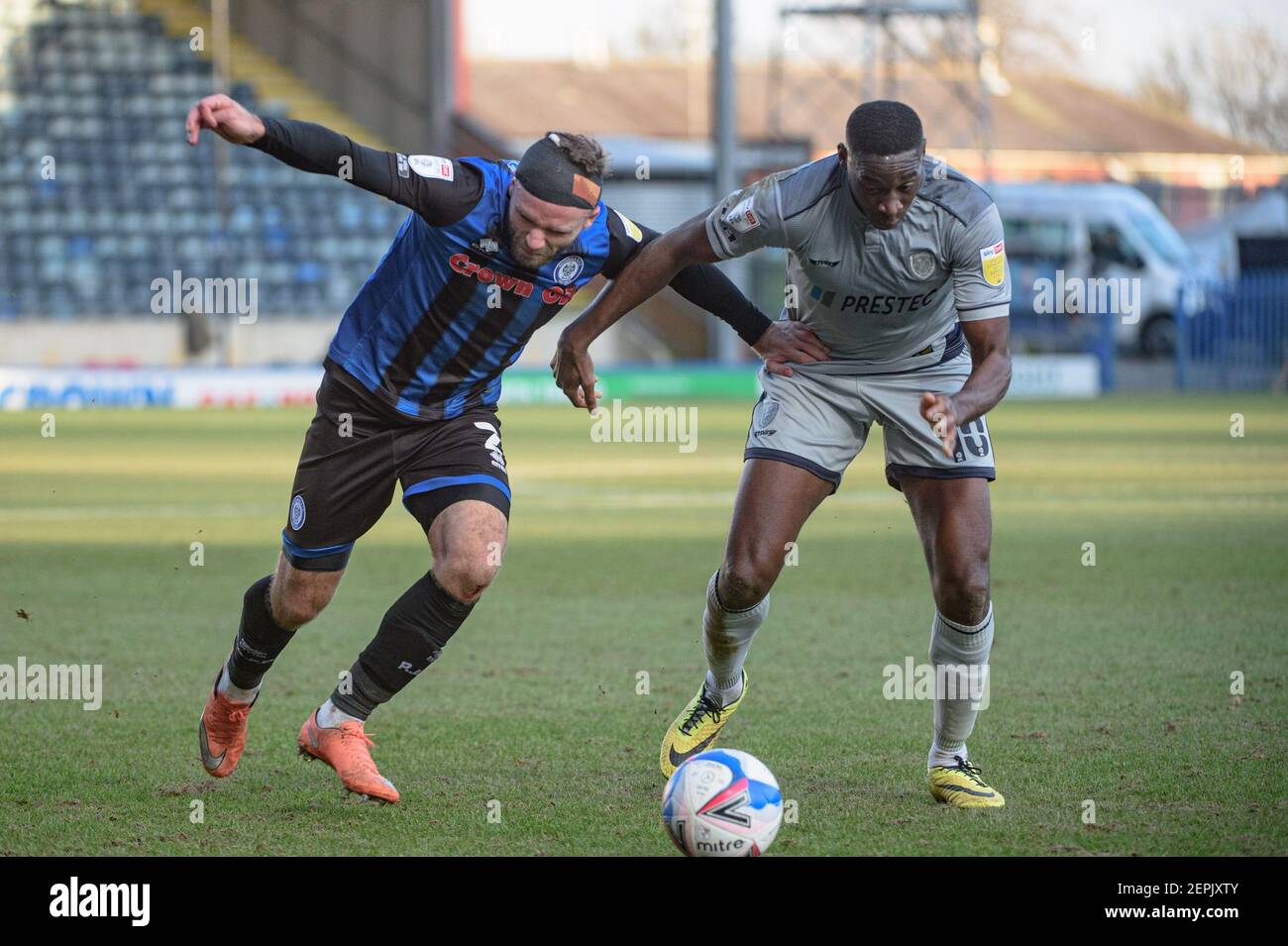 ROCHDALE, ENGLAND. FEB 27TH Ryan McLaughlin of Rochdale AFC under pressure  from Lucas Akins of Burton Albion during the Sky Bet League 1 match between  Rochdale and Burton Albion at Spotland Stadium,