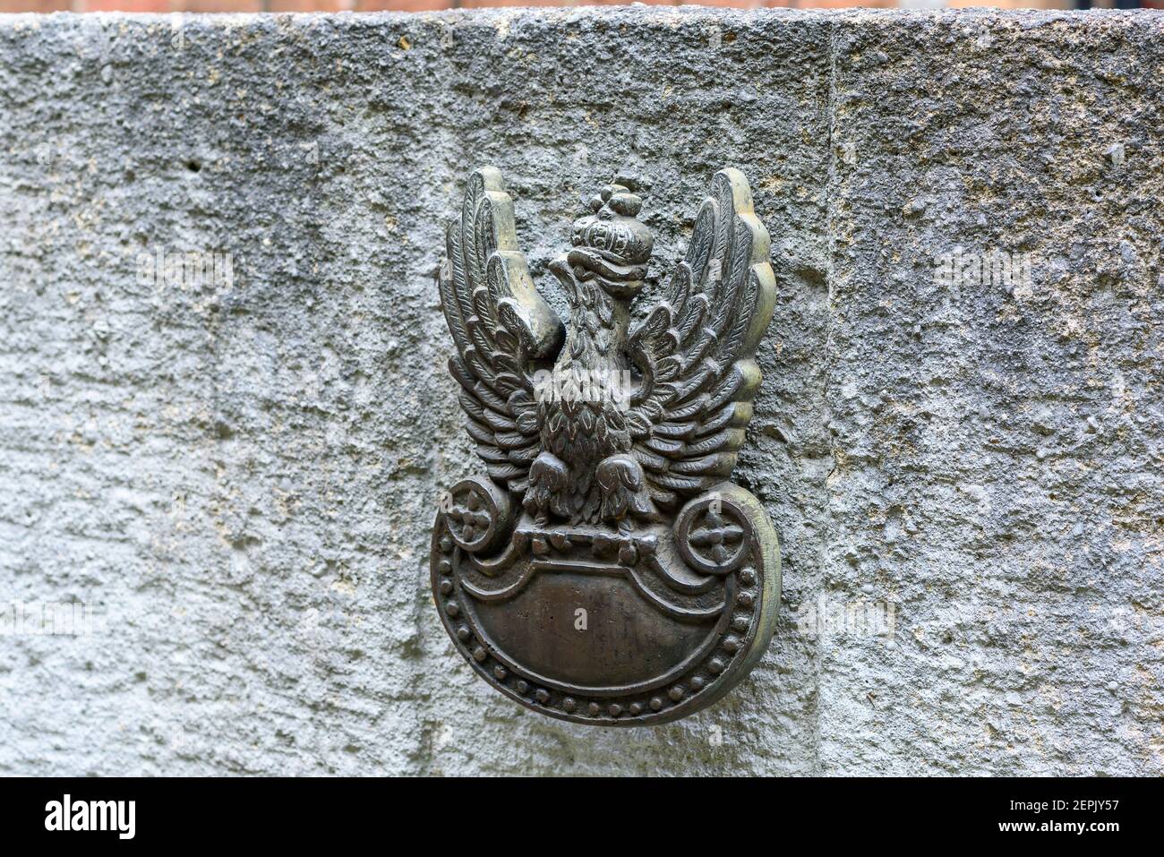 Poznan, wielkopolskie/Poland: 06.07.2019: a close-up of a symbol of the eagle in a crown on the wall in the Cytadela Park, Poznan Stock Photo