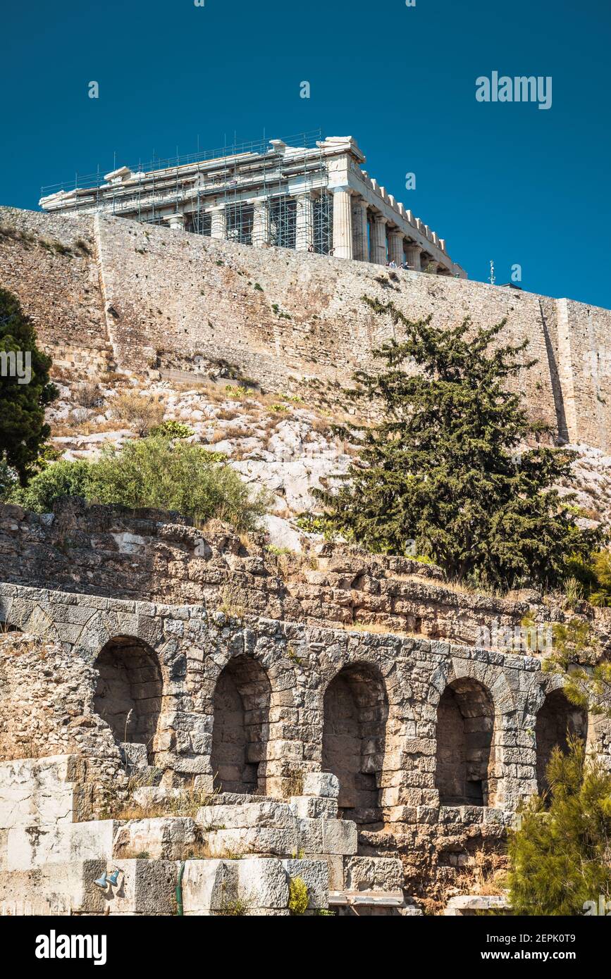 Acropolis of Athens, Greece. Vertical view of Herodes Odeon and Parthenon temple. This place is top landmark of Athens. Scenery of Ancient Greek ruins Stock Photo
