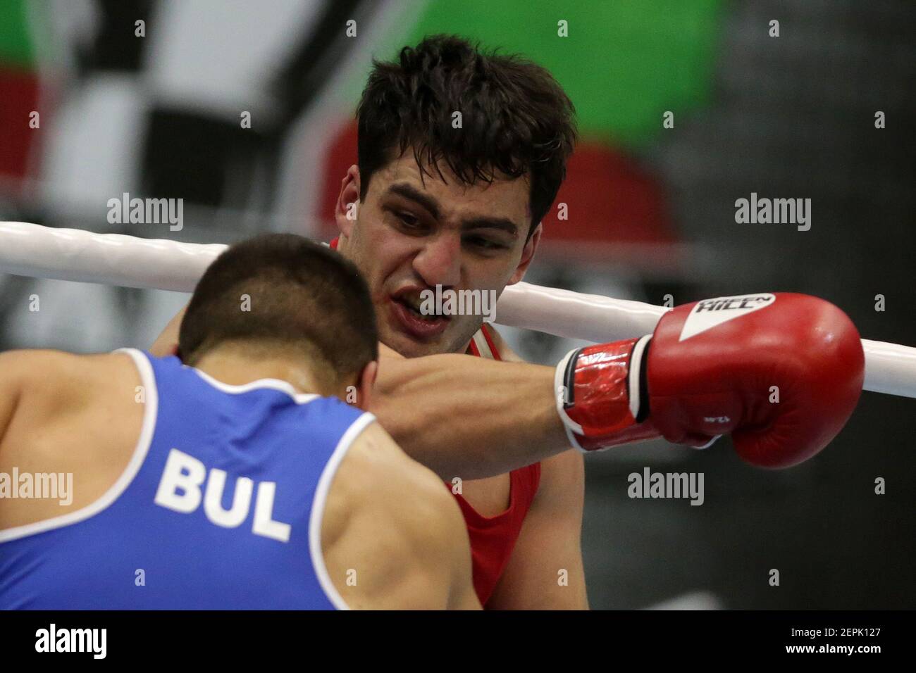 Sofia, Bulgaria. 27th February, 2021. Narek Manasyan (red) of Armenia and Radoslav Pantaleev of Bulgaria fight in their final round of Heavy (91kg) category of the 72-nd International Boxing Tournament 'Strandja' 2021. Credit: Pluto/Alamy Live News Stock Photo