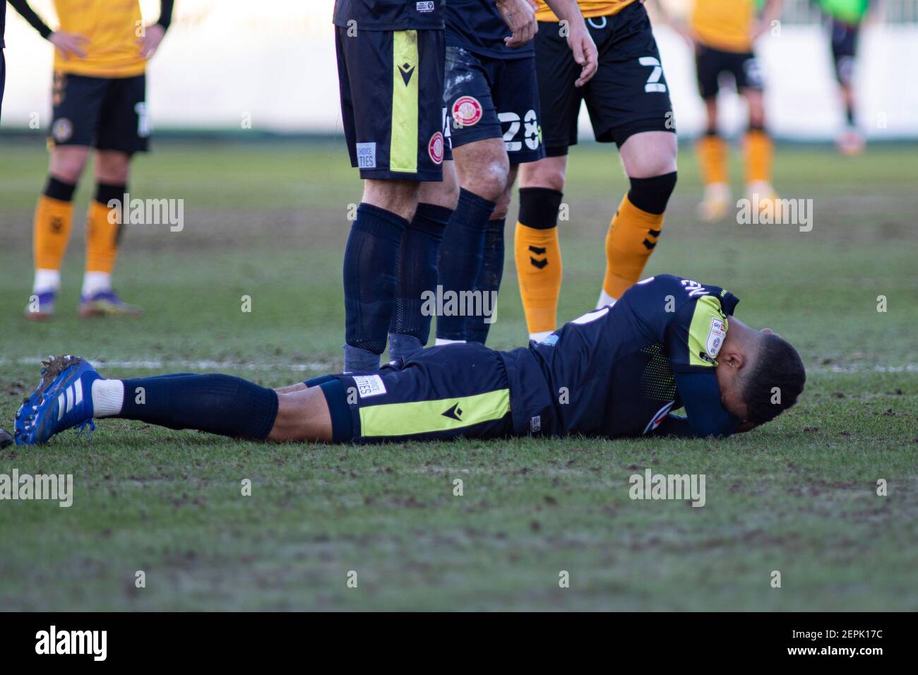 Newport, UK. 27th Feb, 2021. Terence Vancooten of Stevenage on the floor after a head collision. EFL football league two match, Newport county v Stevenage at Rodney Parade in Newport, Wales on Saturday 27th February 2021. this image may only be used for Editorial purposes. Editorial use only, license required for commercial use. No use in betting, games or a single club/league/player publications. pic by Lewis Mitchell/Andrew Orchard sports photography/Alamy Live news Credit: Andrew Orchard sports photography/Alamy Live News Stock Photo