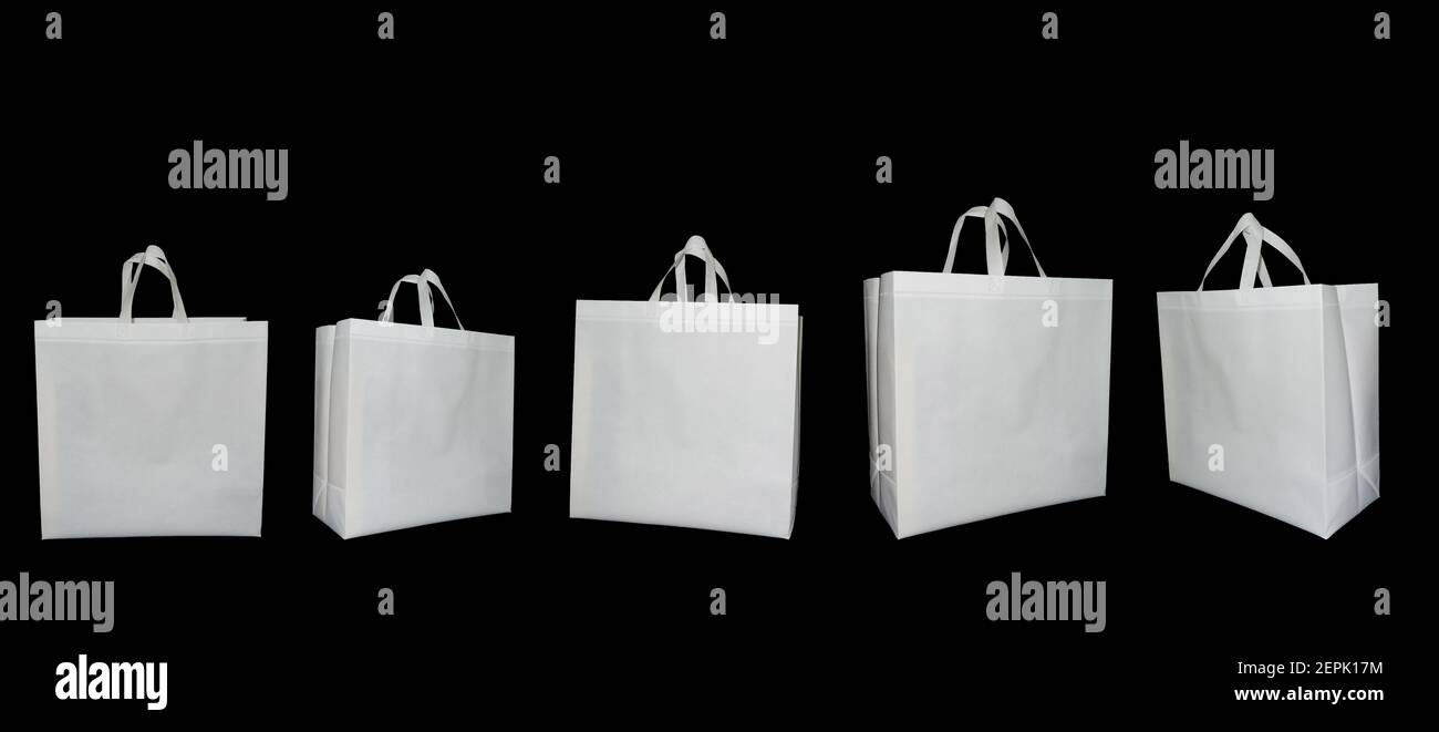 Set of Non Woven white Fabric handle loop Bags on black color Background. Non Woven ECO Friendly Shopping Bags. Biodegradable Bags. Mock-up Stock Photo