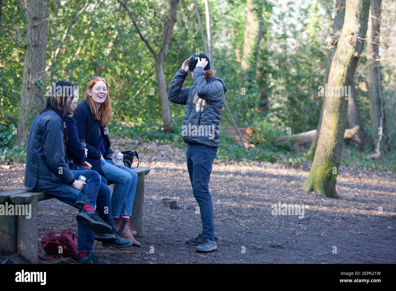 UK Weather, London, 27 February 2021: People and dogs took exercise in Dulwich wetather on a sunny afternoon, although temperatures only reached 12 centigrade. Under coronavirus lockdown regulations one individual may meet another outdoors for exercise and families may exercise within their bubbles. Anna Watson/Alamy Live News Stock Photo