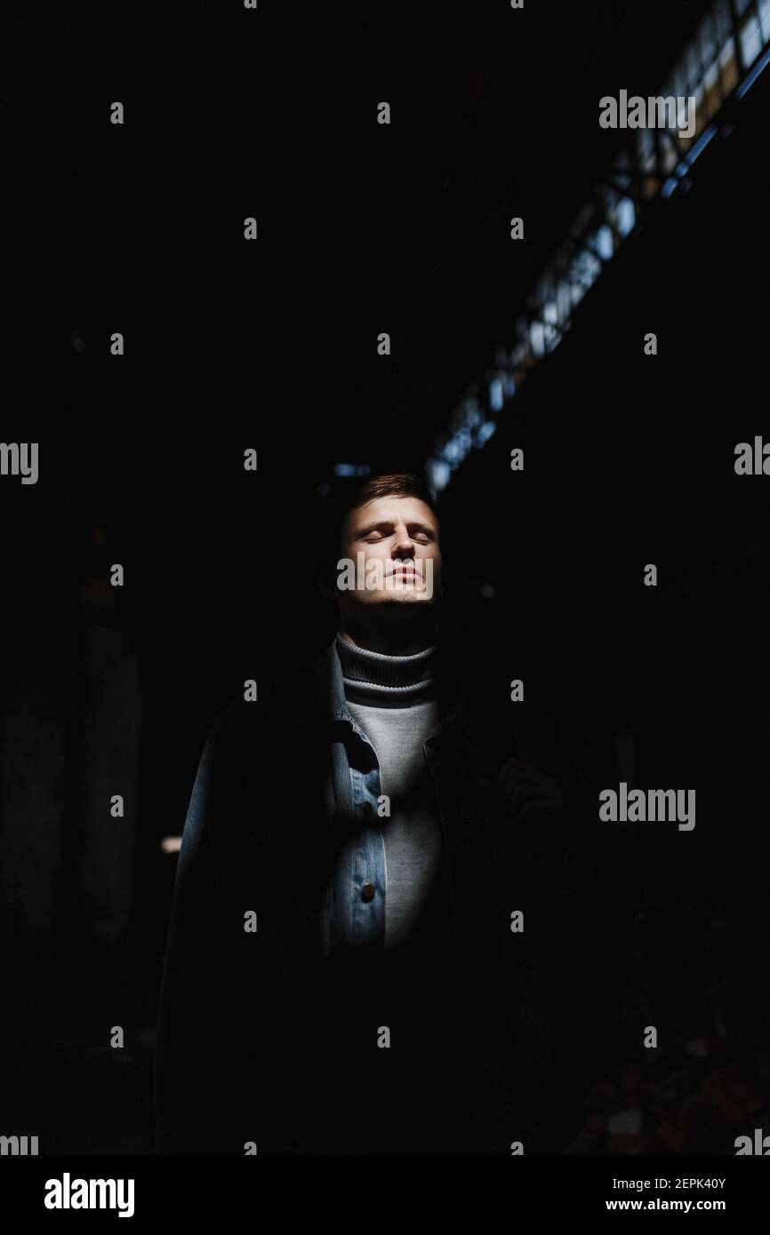 Brutal man on the dark background with place for your text Stock Photo