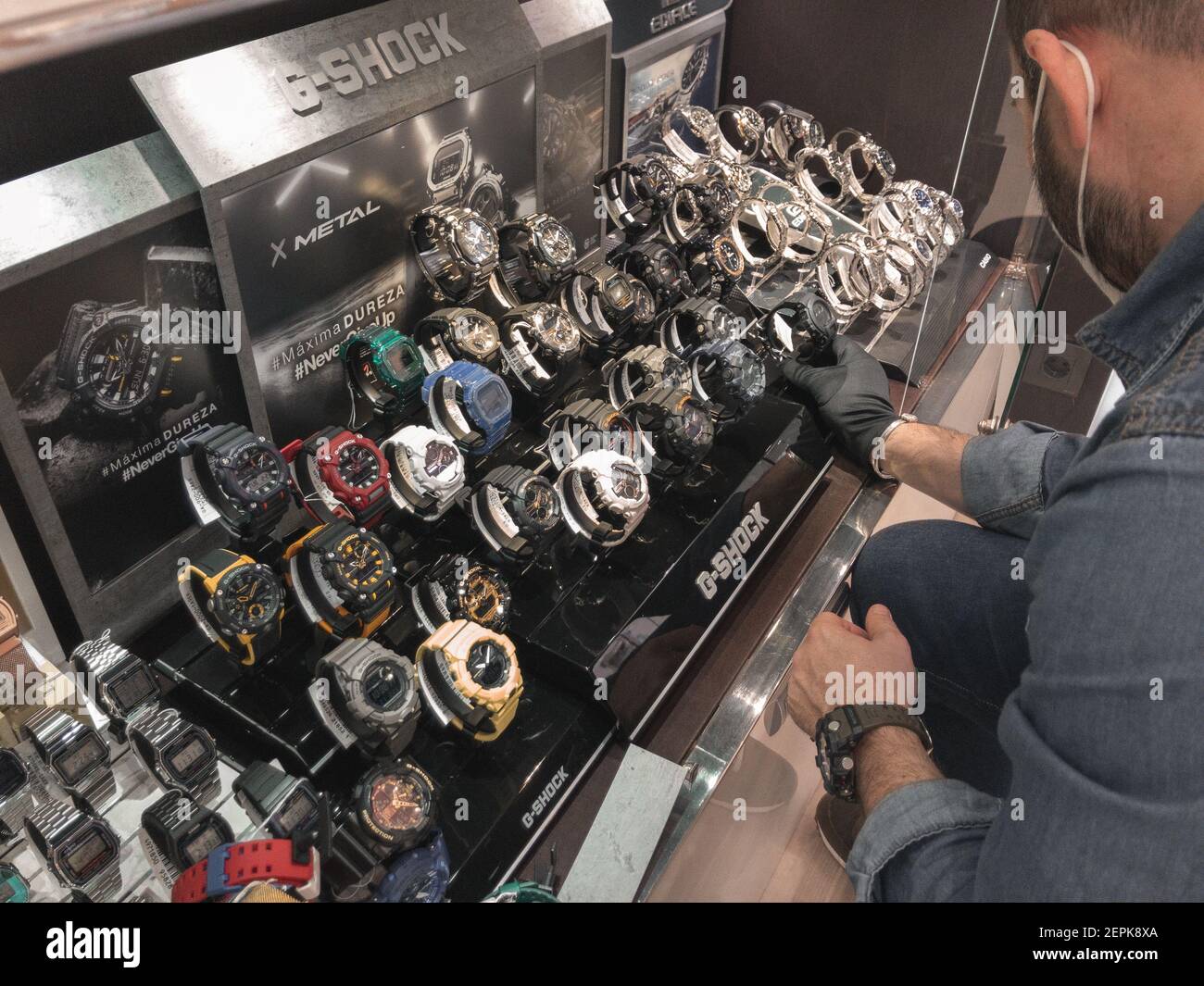 Alicante, Spain - February, 2021: Merchandiser arranging Casio G-shock  watches on display in boutique Stock Photo - Alamy