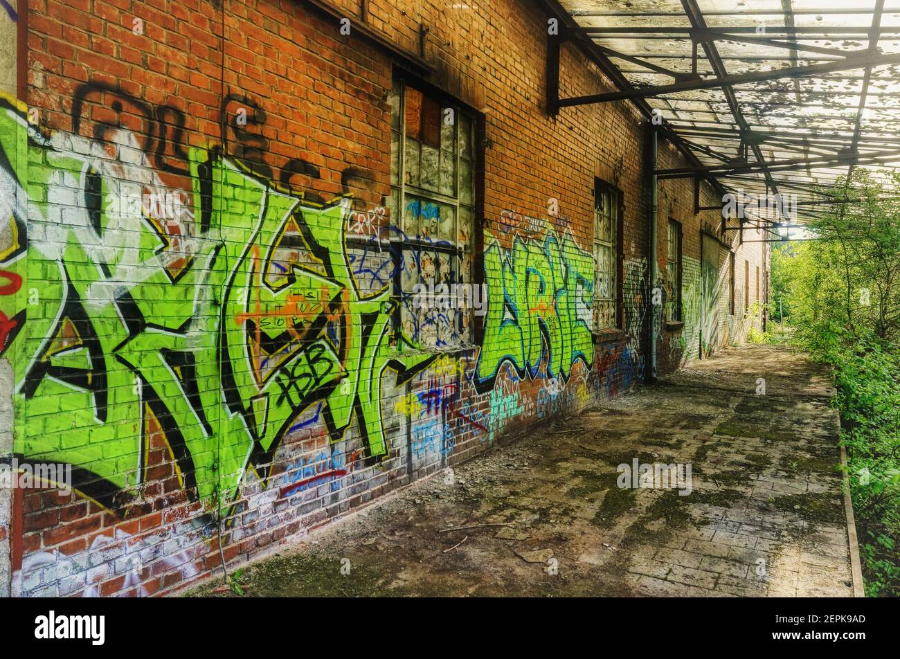 An abandoned and graffiti covered railway station in Berlin, Germany Stock Photo